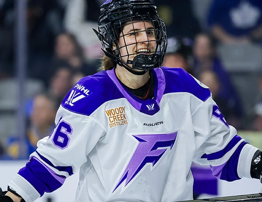 Michela Cava smiling in a Minnesota Frost jersey