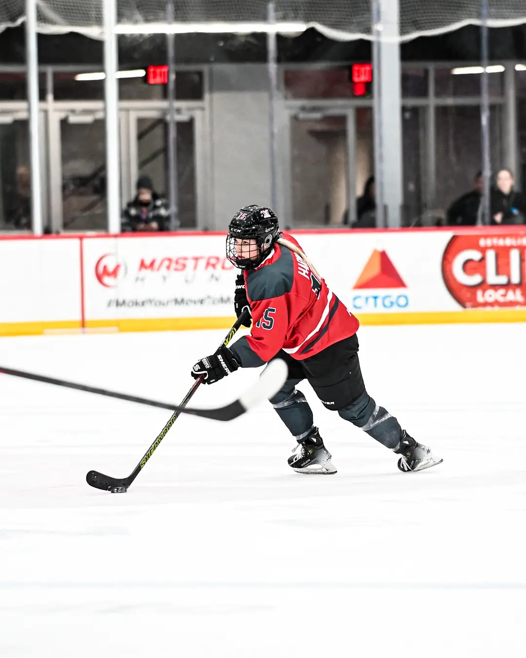 Savannah Harmon carrying the puck in her PWHL Ottawa jersey