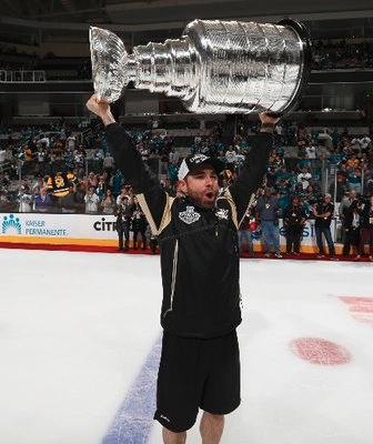 Andy O'Brien lifting the Stanley cup